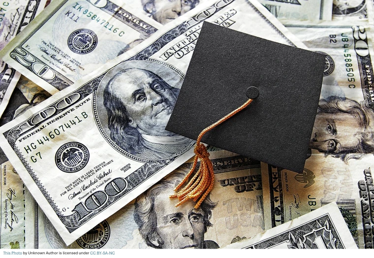 Mortarboard with cash